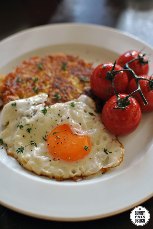 This morning's breakfast. Gluten free, vegetarian, yum. Cumin parmesan hash brown, a fried egg and grilled tomatoes. The Koala's version also included bacon.